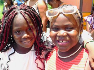 Friends Hugging And Smiling Stock Photo